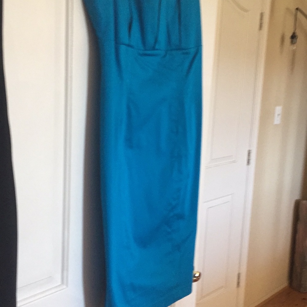 Sleeveless turquoise blue Calvin Klein dress.